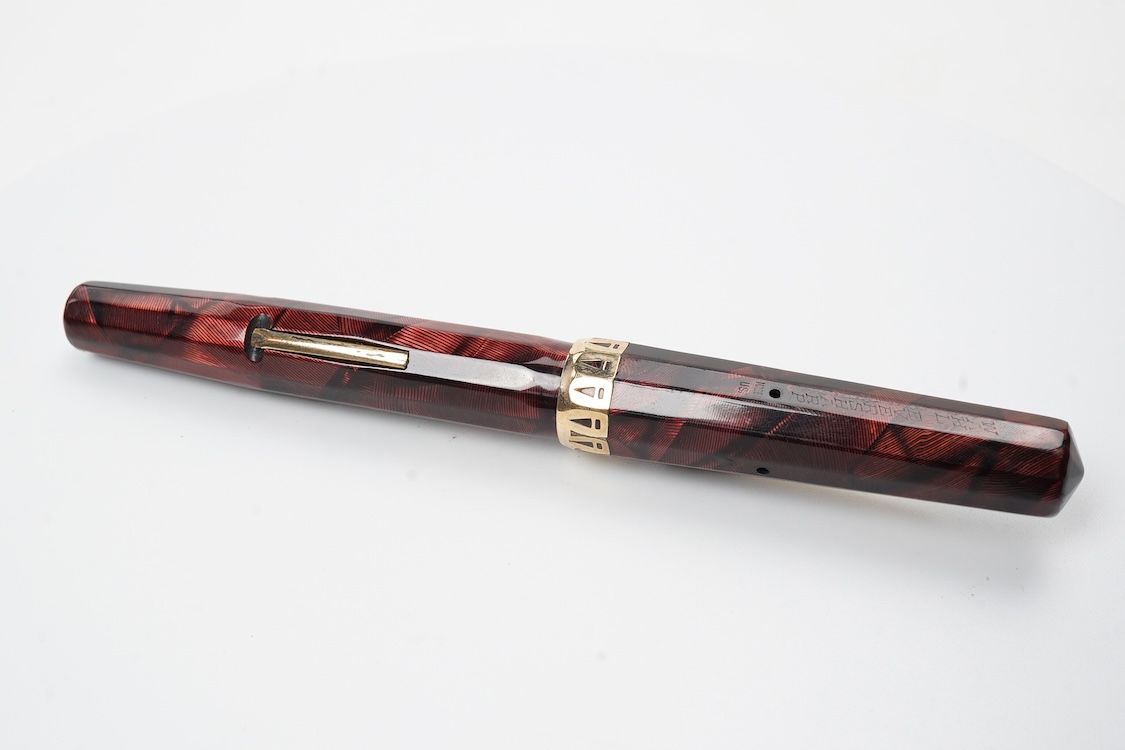 A Wahl Eversharp lever fill 'Doric' fountain pen in garnet colour with gold filled trim